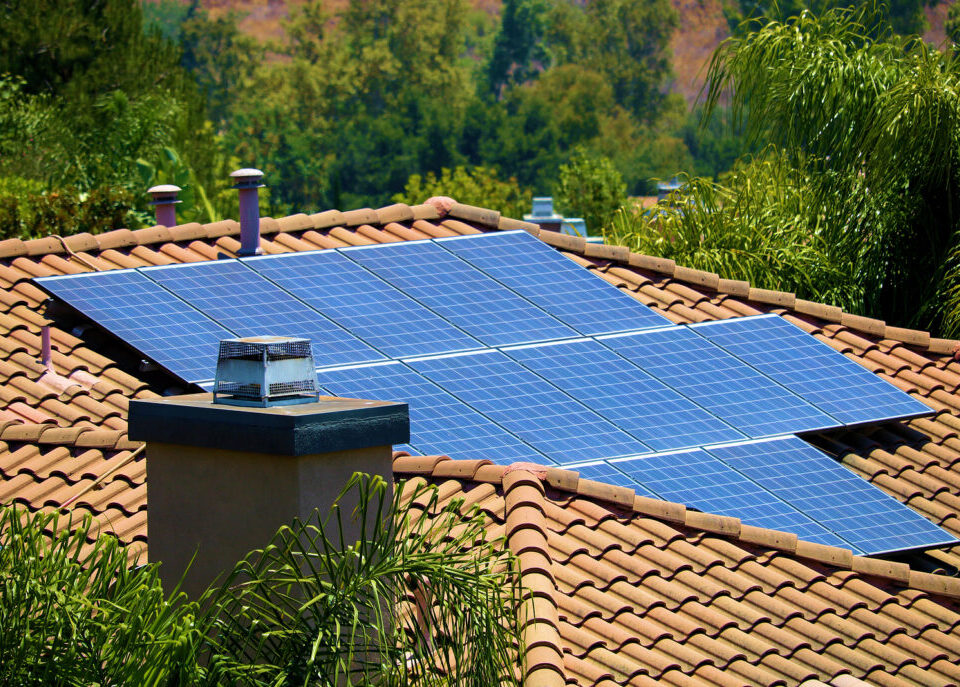 Modern Solar Panels On The Roof Of A House Generating Clean Alte